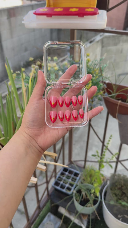 Get ready for "Red Retro Starburst" with these stunning, retro starburst design press-on nails. Featuring a pink base, red french tip design, and gold starbursts with a glossy finish. Each set is a miniature work of art, meticulously designed and hand-painted, adding a unique flair to any occasion. No time for salon appointments? Say hello to instant glamour that’s ready whenever you are. Our durable, high-quality press-ons offer a flawless, comfortable fit and are designed to last.