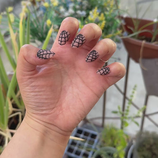 Get ready for "Nude Web" with these stunning, spiderweb design press-on nails. Featuring a nude base and black web with a matte finish. Each set is a miniature work of art, meticulously designed and hand-painted, adding a unique flair to any occasion. No time for salon appointments? Say hello to instant glamour that’s ready whenever you are. Our durable, high-quality press-ons offer a flawless, comfortable fit and are designed to last.