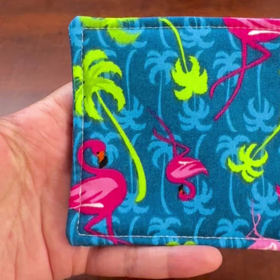 Elevate your space with this playful 100% cotton flamingo coaster. Featuring a vibrant and stylish flamingo print, this coaster brings a touch of tropical flair and fun to your home. Crafted with an absorbent cotton batting layer inside, it's designed to soak up condensation and protect your furniture from unsightly water rings and spills. Perfect for coffee mugs, glasses, or teacups, this durable and machine-washable coaster is a delightful addition to your kitchen or living room. Elevate your home decor w