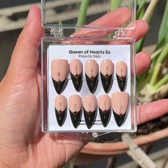 Get ready for "The Witching Hour 2.0" and embrace dark glamour with these stunning handmade press-on nails, featuring a rich nude base and delicate, black french tip and star design.&nbsp;