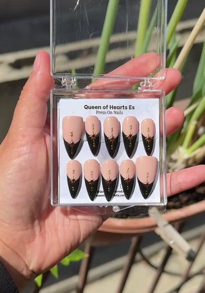Get ready for "The Witching Hour 2.0" and embrace dark glamour with these stunning handmade press-on nails, featuring a rich nude base and delicate, black french tip and star design.&nbsp;