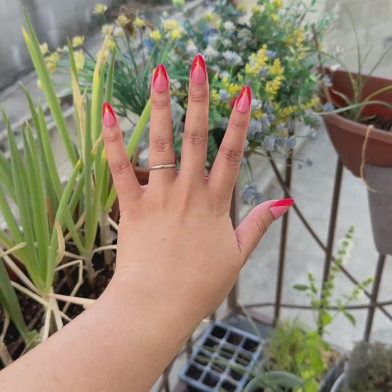 Get ready for "Red Retro Starburst" with these stunning, retro starburst design press-on nails. Featuring a pink base, red french tip design, and gold starbursts with a glossy finish. Each set is a miniature work of art, meticulously designed and hand-painted, adding a unique flair to any occasion. No time for salon appointments? Say hello to instant glamour that’s ready whenever you are. Our durable, high-quality press-ons offer a flawless, comfortable fit and are designed to last.