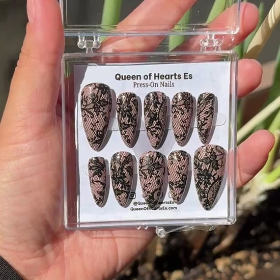 Get ready for "The Seductress" and embrace dark glamour with these stunning handmade press-on nails, featuring a rich nude base and delicate, black lace design.&nbsp;