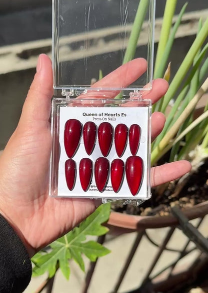 Get ready for "The Romantic" and embrace dark glamour with these stunning handmade press-on nails, featuring a red cat eye base and delicate, reflective design.