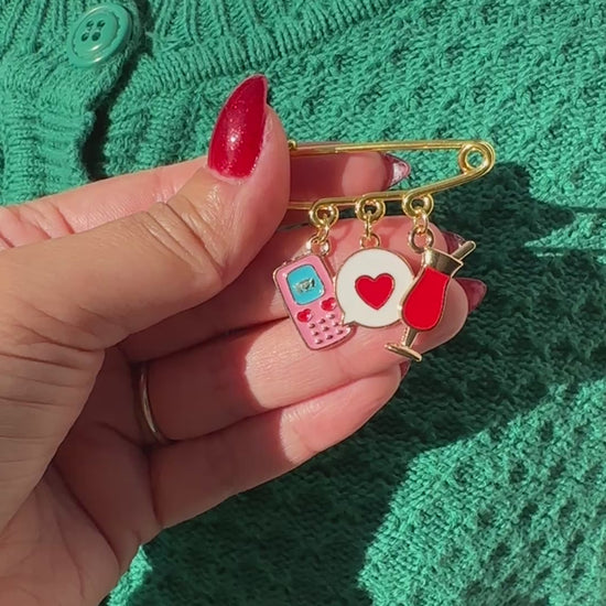 Elevate your Valentines Day or Galentines Day with this adorable gold iron pin brooch featuring a phone, chat box, and a drink enamel charms. Perfect for adding a touch of love to any outfit.