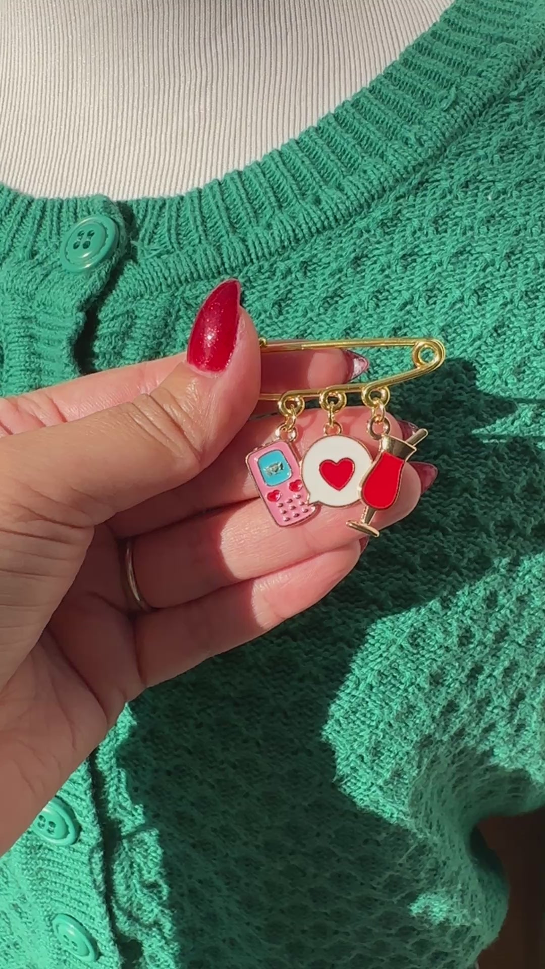 Elevate your Valentines Day or Galentines Day with this adorable gold iron pin brooch featuring a phone, chat box, and a drink enamel charms. Perfect for adding a touch of love to any outfit.