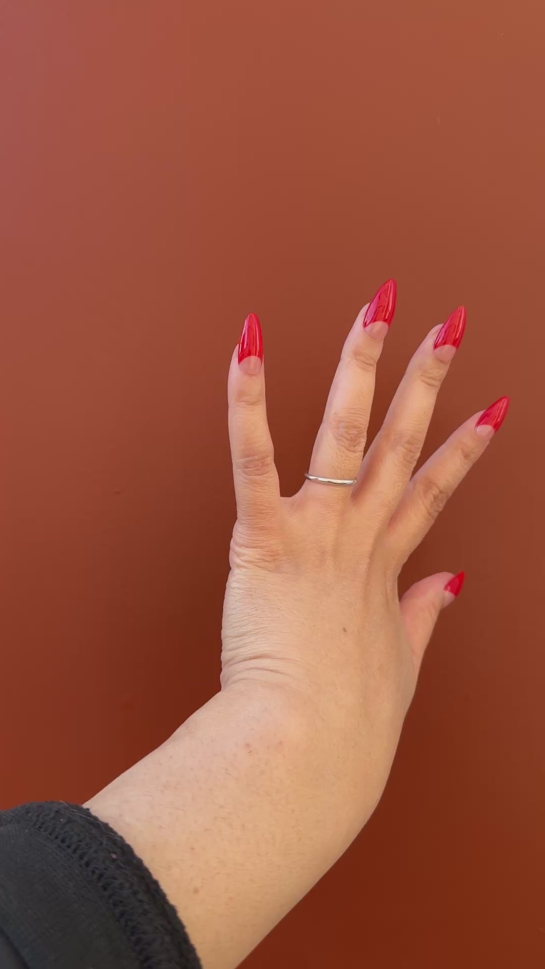 Get ready for "The Red Half Moon" and embrace dark glamour with these stunning handmade press-on nails, featuring a nude base and delicate, red half moon design.