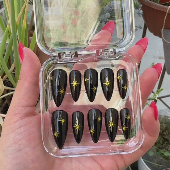 Get ready for "The Witching Hour" with these stunning, celestial press-on nails. Featuring a mysterious, deep black base and shimmering gold stars, this set captures the magic of a midnight sky. Each set is a miniature work of art, meticulously designed and hand-painted, adding a unique flair to any occasion. No time for salon appointments? Say hello to instant glamour that’s ready whenever you are. Our durable, high-quality press-ons offer a flawless, comfortable fit and are designed to last.