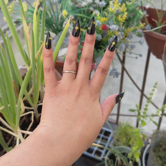 Get ready for "The Witching Hour" with these stunning, celestial press-on nails. Featuring a mysterious, deep black base and shimmering gold stars, this set captures the magic of a midnight sky. Each set is a miniature work of art, meticulously designed and hand-painted, adding a unique flair to any occasion. No time for salon appointments? Say hello to instant glamour that’s ready whenever you are. Our durable, high-quality press-ons offer a flawless, comfortable fit and are designed to last.