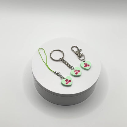 Add a touch of sweetness to your everyday! Our green candy heart phone charm and keychain is the perfect accessory for Valentine’s Day and beyond. Cute, durable, and versatile, it’s the perfect gift for yourself or a loved one.